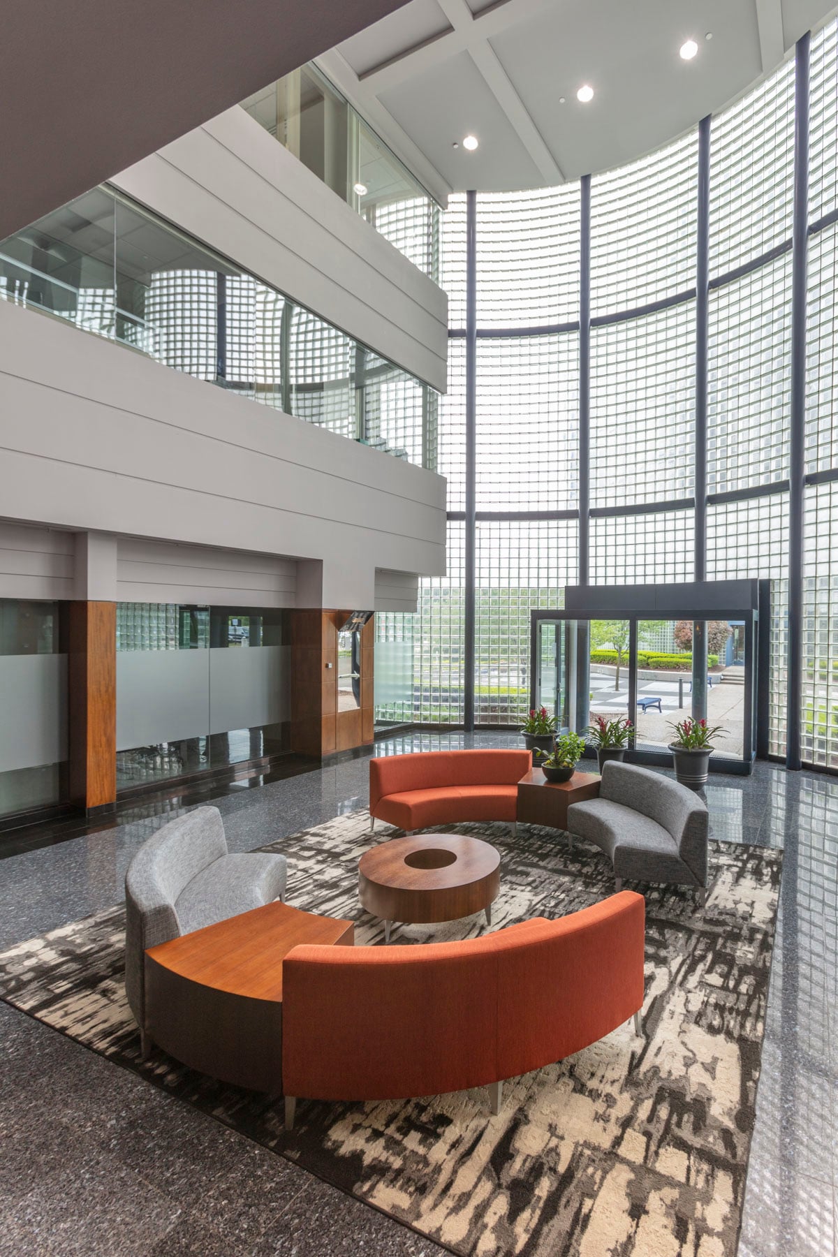Lobby interior with curved glass-block wall